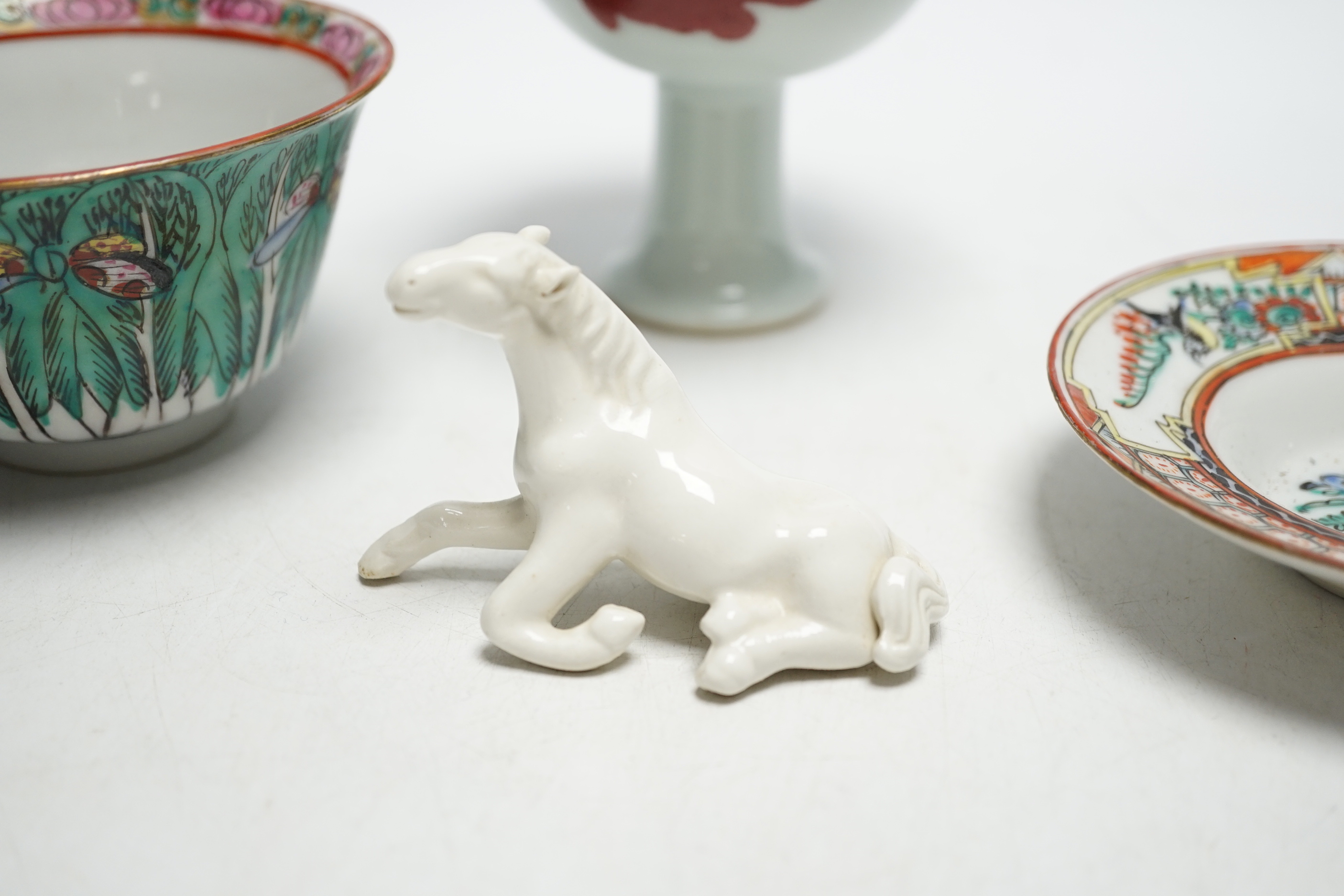 A Chinese tea bowl and stand, a white glazed horse and a pedestal bowl, tallest 9cm high